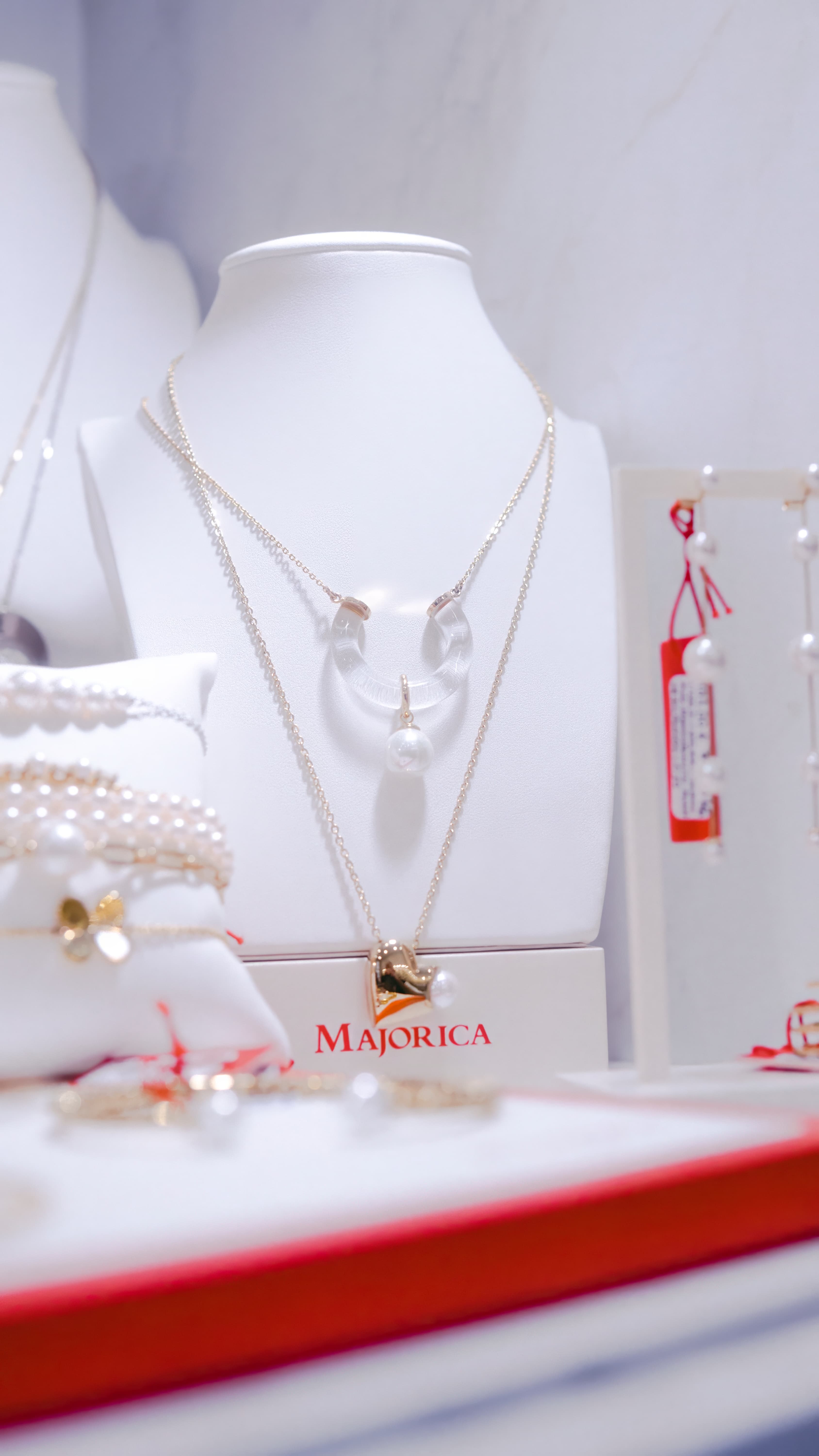Fine jewellery arranged in a softly lit Pulito display